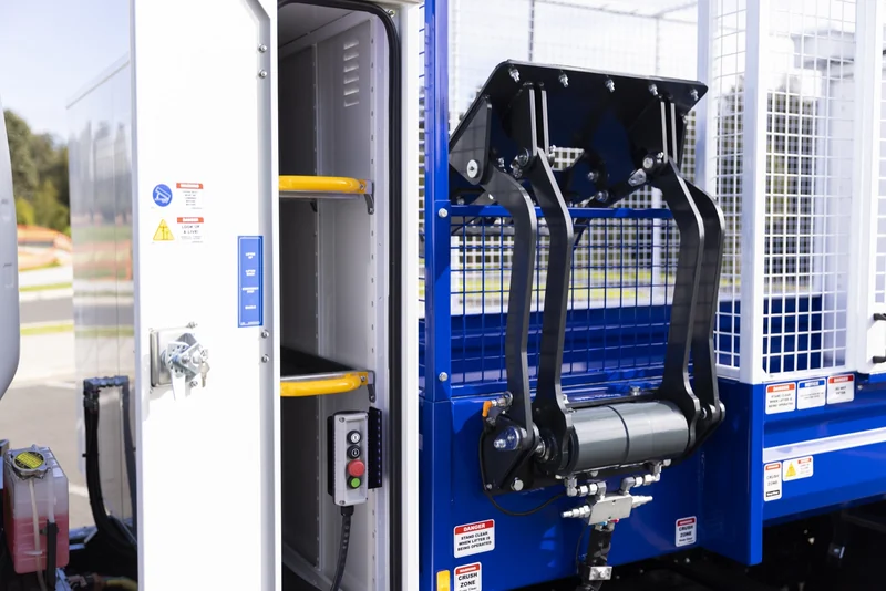 Bin lifter and control station on a Russ cage litter tipper