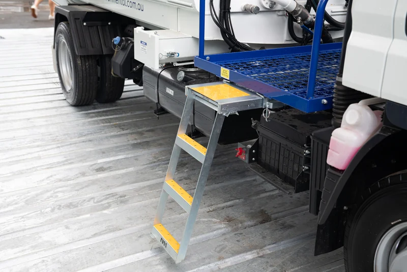 A galvanised access ladder with high-visibility non-slip treads.