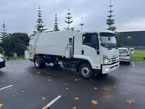A Russ rear-loader collection vehicle.
