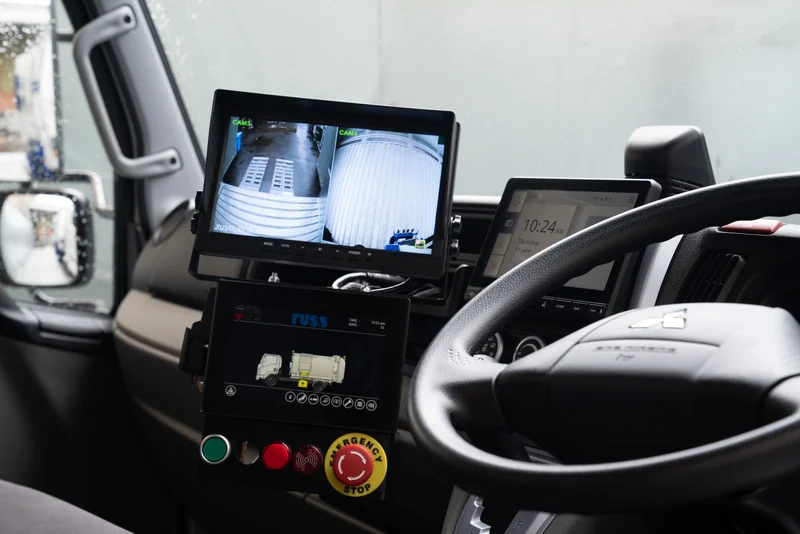 Russ in-cab camera monitor and collection-body control screen.